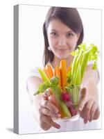 Girl Holding a Bowl of Vegetable Sticks with Radishes-null-Stretched Canvas