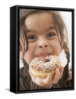 Girl Holding a Doughnut with Sprinkles, Partly Eaten-null-Framed Stretched Canvas