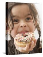 Girl Holding a Doughnut with Sprinkles, Partly Eaten-null-Stretched Canvas