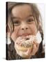 Girl Holding a Doughnut with Sprinkles, Partly Eaten-null-Stretched Canvas