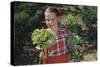 Girl Holding Head of Lettuce in Garden-William P^ Gottlieb-Stretched Canvas