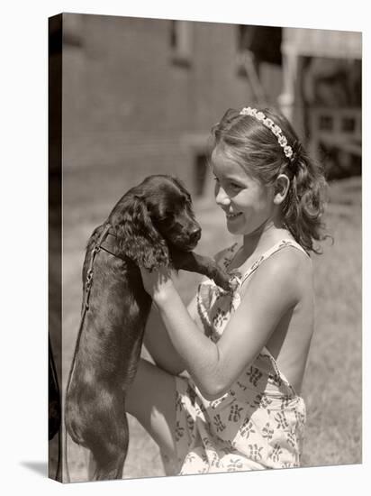 Girl Holding Puppy-Philip Gendreau-Stretched Canvas