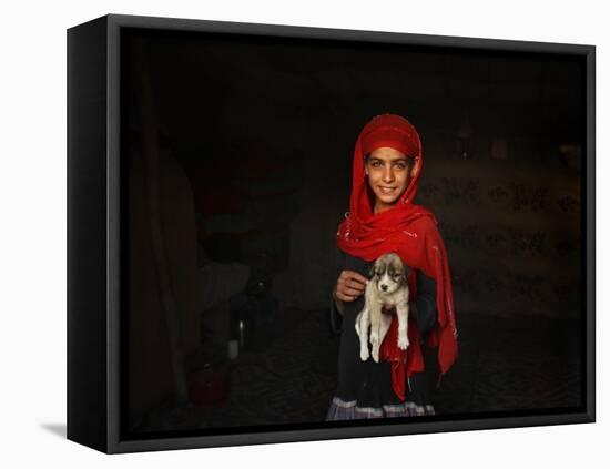 Girl Holds a Puppy as the Sun Sets over Kabul's Impoverished Teppe Maranjan Neighborhood-null-Framed Stretched Canvas