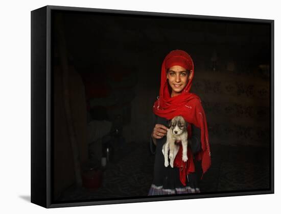 Girl Holds a Puppy as the Sun Sets over Kabul's Impoverished Teppe Maranjan Neighborhood-null-Framed Stretched Canvas