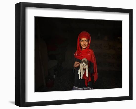 Girl Holds a Puppy as the Sun Sets over Kabul's Impoverished Teppe Maranjan Neighborhood-null-Framed Premium Photographic Print