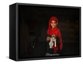 Girl Holds a Puppy as the Sun Sets over Kabul's Impoverished Teppe Maranjan Neighborhood-null-Framed Stretched Canvas