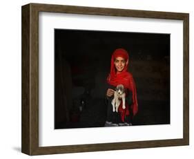 Girl Holds a Puppy as the Sun Sets over Kabul's Impoverished Teppe Maranjan Neighborhood-null-Framed Photographic Print