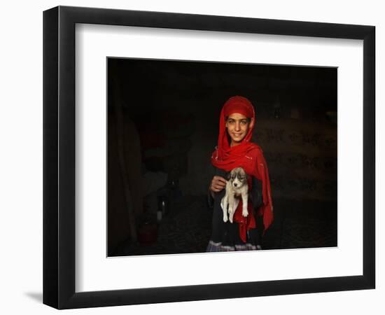 Girl Holds a Puppy as the Sun Sets over Kabul's Impoverished Teppe Maranjan Neighborhood-null-Framed Photographic Print