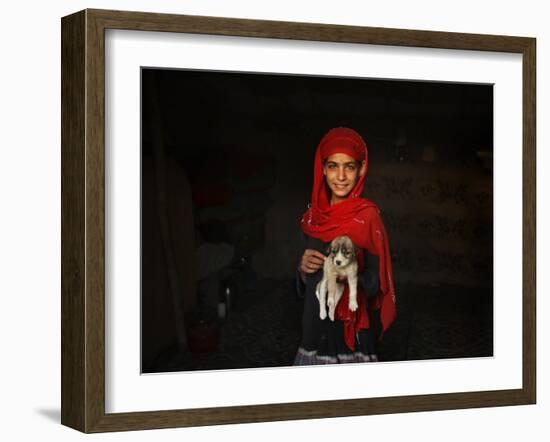 Girl Holds a Puppy as the Sun Sets over Kabul's Impoverished Teppe Maranjan Neighborhood-null-Framed Photographic Print