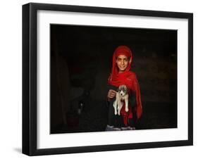 Girl Holds a Puppy as the Sun Sets over Kabul's Impoverished Teppe Maranjan Neighborhood-null-Framed Photographic Print