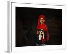 Girl Holds a Puppy as the Sun Sets over Kabul's Impoverished Teppe Maranjan Neighborhood-null-Framed Photographic Print