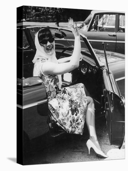 Girl in a Flower Print Dress, High Heels, Headscarf and Sunglasses Steps out of a Convertible Car-null-Stretched Canvas