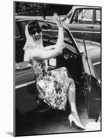 Girl in a Flower Print Dress, High Heels, Headscarf and Sunglasses Steps out of a Convertible Car-null-Mounted Photographic Print