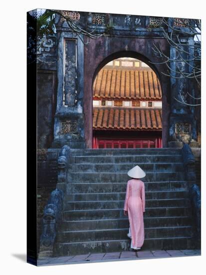 Girl in Ao Dai (Traditional Vietnamese Long Dress) and Conical Hat at Minh Mang Tomb, Vietnam-Keren Su-Stretched Canvas