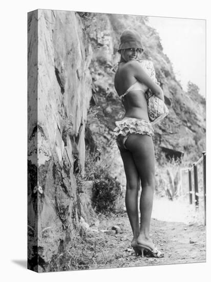 Girl in Bikini Walks Along a Cliff Path on a Fine Summer Day-null-Stretched Canvas