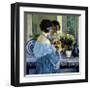 Girl in Blue Arranging Flowers, c1915-Frederick Carl Frieseke-Framed Premium Giclee Print