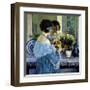 Girl in Blue Arranging Flowers, c1915-Frederick Carl Frieseke-Framed Premium Giclee Print