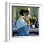 Girl in Blue Arranging Flowers, c1915-Frederick Carl Frieseke-Framed Premium Giclee Print