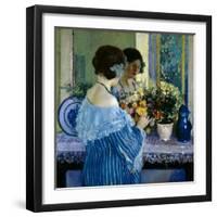 Girl in Blue Arranging Flowers (Oil on Canvas)-Frederick Carl Frieseke-Framed Giclee Print