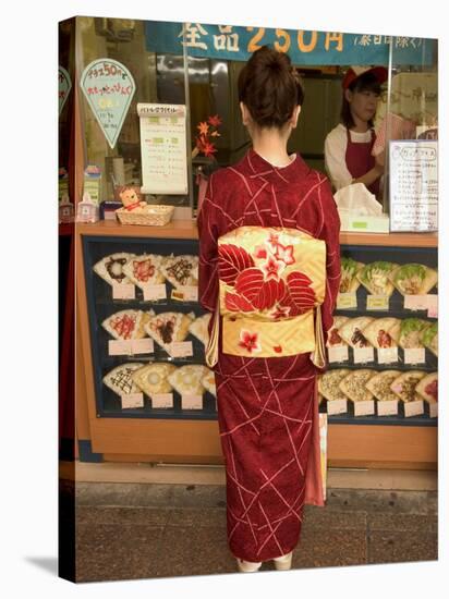 Girl in Kimono, Yukata Buying Crepe, Kyoto City, Honshu, Japan-Christian Kober-Stretched Canvas