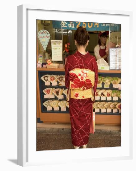 Girl in Kimono, Yukata Buying Crepe, Kyoto City, Honshu, Japan-Christian Kober-Framed Photographic Print