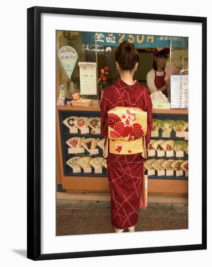 Girl in Kimono, Yukata Buying Crepe, Kyoto City, Honshu, Japan-Christian Kober-Framed Photographic Print