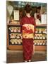 Girl in Kimono, Yukata Buying Crepe, Kyoto City, Honshu, Japan-Christian Kober-Mounted Photographic Print