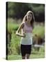 Girl Jogging with Headphones-null-Stretched Canvas