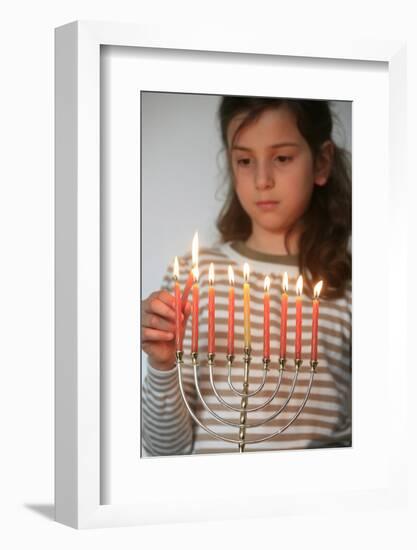 Girl lighting Hannuka candles, Montrouge, France-Godong-Framed Photographic Print