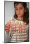 Girl lighting Hannuka candles, Montrouge, France-Godong-Mounted Photographic Print