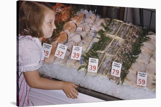 Girl Looking at Seafood Display-William P. Gottlieb-Stretched Canvas