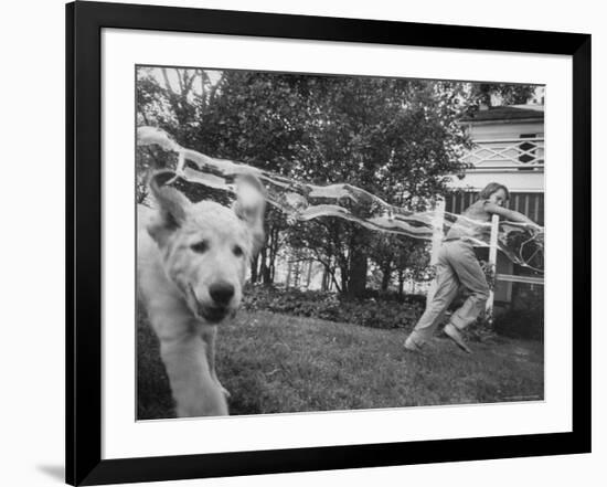 Girl Making Huge Bubbles with Soapy Solution and Large Ring in Yard-Stan Wayman-Framed Photographic Print