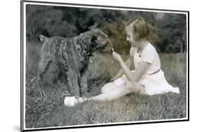 Girl Offering Her Dog a Lollipop-null-Mounted Photographic Print