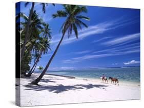 Girl on Beach with Coconut Palm Trees, Tambua Sands Resort, Coral Coast, Fiji-David Wall-Stretched Canvas