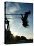 Girl Playing High on Swings at Sunset on Vosu Beach, Located in Lahemaa National Park-Christian Kober-Stretched Canvas