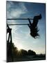 Girl Playing High on Swings at Sunset on Vosu Beach, Located in Lahemaa National Park-Christian Kober-Mounted Photographic Print