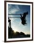 Girl Playing High on Swings at Sunset on Vosu Beach, Located in Lahemaa National Park-Christian Kober-Framed Photographic Print