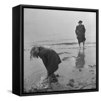 Girl Playing in the Sand while an Older Woman Gets Her Feet Wet in the Ocean at Blackpool Beach-Ian Smith-Framed Stretched Canvas