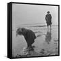 Girl Playing in the Sand while an Older Woman Gets Her Feet Wet in the Ocean at Blackpool Beach-Ian Smith-Framed Stretched Canvas