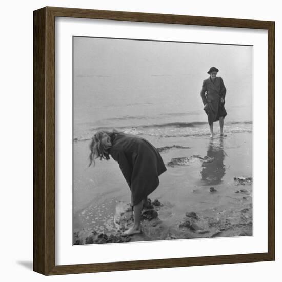 Girl Playing in the Sand while an Older Woman Gets Her Feet Wet in the Ocean at Blackpool Beach-Ian Smith-Framed Photographic Print