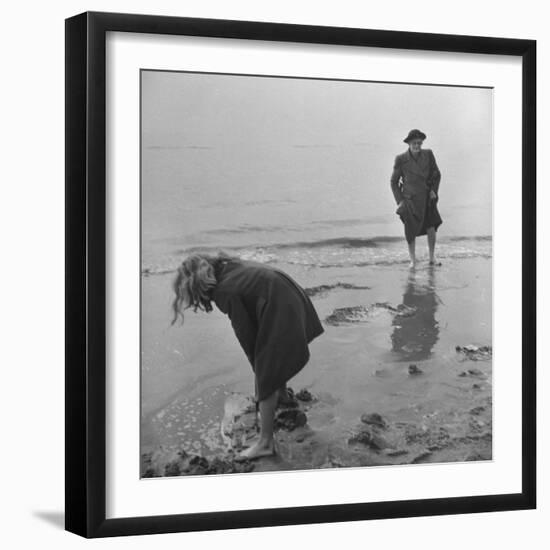 Girl Playing in the Sand while an Older Woman Gets Her Feet Wet in the Ocean at Blackpool Beach-Ian Smith-Framed Photographic Print