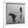 Girl Playing in the Sand while an Older Woman Gets Her Feet Wet in the Ocean at Blackpool Beach-Ian Smith-Framed Photographic Print