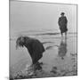 Girl Playing in the Sand while an Older Woman Gets Her Feet Wet in the Ocean at Blackpool Beach-Ian Smith-Mounted Photographic Print