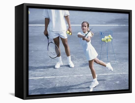 Girl Playing Tennis Under Supervision of a Coach-null-Framed Stretched Canvas