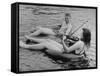 Girl Playing Violin For Boy as They Float on Inner Tube Sat Floating Party on the Apple River-Alfred Eisenstaedt-Framed Stretched Canvas