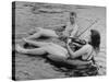 Girl Playing Violin For Boy as They Float on Inner Tube Sat Floating Party on the Apple River-Alfred Eisenstaedt-Stretched Canvas