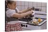 Girl Preparing Breakfast in Kitchen-William P. Gottlieb-Stretched Canvas