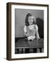 Girl Putting Money in Piggy Bank-Philip Gendreau-Framed Photographic Print