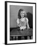 Girl Putting Money in Piggy Bank-Philip Gendreau-Framed Photographic Print