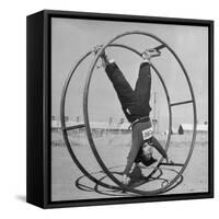 Girl Rolling in Large Wheel During Physical Education Class at North China Union University-George Lacks-Framed Stretched Canvas